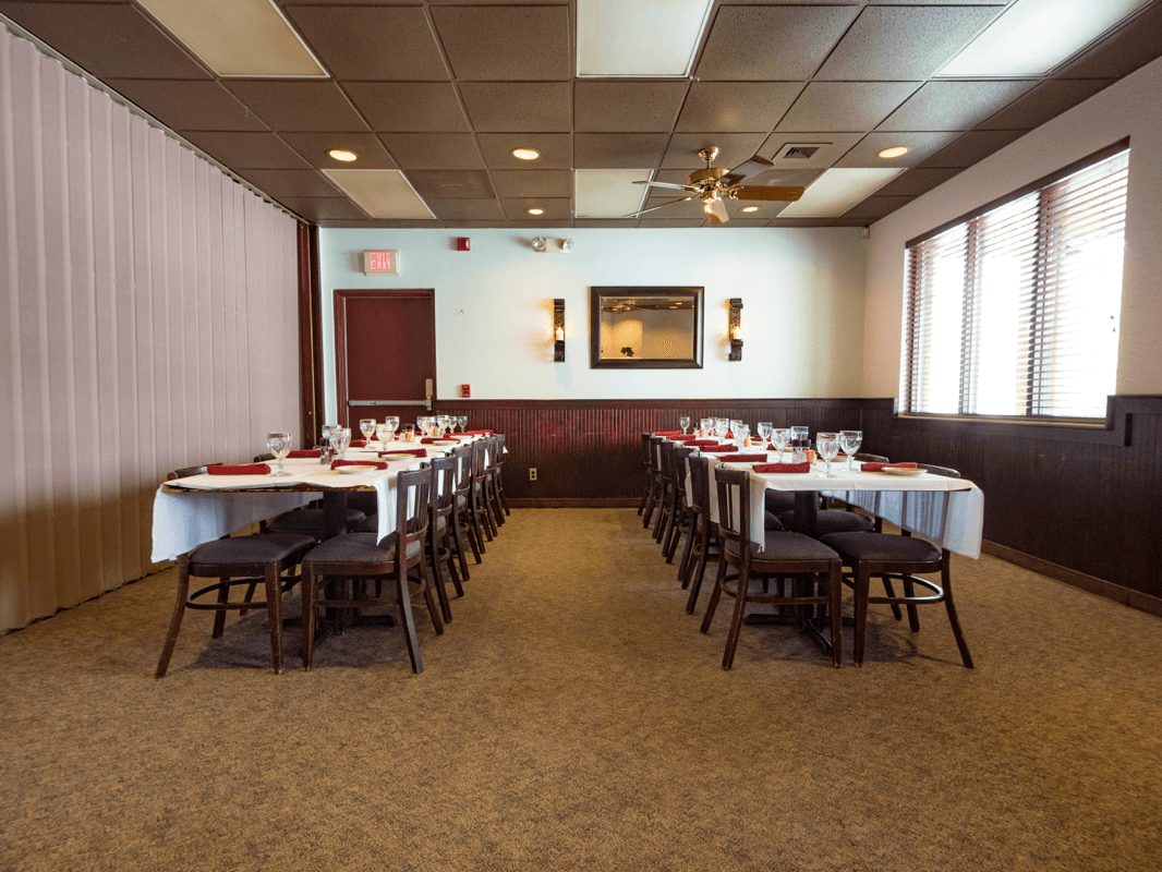 two rows of tables in banquet room